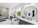 Bright bathroom featuring double vanities, a soaking tub, and a window with a view at 4530 Tournette Dr # 18, Indian Land, SC 29707