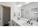 Modern bathroom with double sinks, stylish black fixtures, and an adjacent shower at 4530 Tournette Dr # 18, Indian Land, SC 29707