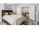 Comfortable bedroom with a bed, plush throw blanket and pillows, complemented by a vanity area, and neutral tones at 4530 Tournette Dr # 18, Indian Land, SC 29707
