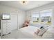 Bright bedroom with a white bed, built-in wardrobe, and desk by the window at 4530 Tournette Dr # 18, Indian Land, SC 29707