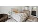 Cozy bedroom with decoratively patterned bedspread, a chair, and matching vanity at 4530 Tournette Dr # 18, Indian Land, SC 29707