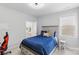 Comfortable bedroom featuring a blue quilted bedspread and access to the ensuite bathroom at 4530 Tournette Dr # 18, Indian Land, SC 29707