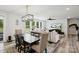 Open living area adjacent to a dining table, featuring natural light from the windows and modern furnishings at 4530 Tournette Dr # 18, Indian Land, SC 29707