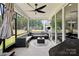 Inviting screened-in porch with stylish furniture, ceiling fan, and outdoor TV for relaxing and entertaining at 4530 Tournette Dr # 18, Indian Land, SC 29707