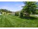A spacious, well-maintained backyard with lush green grass and mature landscaping at 4975 Looking Glass Trl, Denver, NC 28037