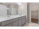 This elegant bathroom features a double vanity, marble countertops, and modern fixtures at 4975 Looking Glass Trl, Denver, NC 28037