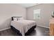 A cozy bedroom with dark floors offers comfort and style at 4975 Looking Glass Trl, Denver, NC 28037