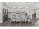 Modern kitchen featuring stainless steel appliances, granite countertops, and a center island with seating at 4975 Looking Glass Trl, Denver, NC 28037