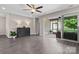 An open living room with an easy transition to the screened-in patio at 4975 Looking Glass Trl, Denver, NC 28037