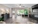 Bright open layout with sleek fireplace, outdoor patio access and contemporary finishes and neutral walls at 4975 Looking Glass Trl, Denver, NC 28037