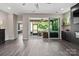 A view of the large living room that looks out onto the screened-in porch at 4975 Looking Glass Trl, Denver, NC 28037