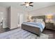 A spacious primary bedroom offers comfort and style at 4975 Looking Glass Trl, Denver, NC 28037