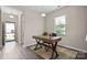 Bright office space with natural light, wood desk, and modern decor, ideal for remote work at 4975 Looking Glass Trl, Denver, NC 28037