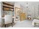 Charming bedroom with elegant wallpaper, wood floors, and a stylish vanity area, creating a cozy and inviting space at 5523 Meadow Haven Ln, Charlotte, NC 28270