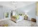 Serene bedroom with vaulted ceilings, soft blue walls, carpet flooring, and decorative mirror at 5523 Meadow Haven Ln, Charlotte, NC 28270