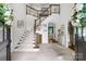 Stunning entryway with a view to adjacent rooms, featuring elegant tile floors and a staircase at 5523 Meadow Haven Ln, Charlotte, NC 28270