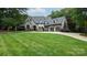 Beautiful home featuring a lush front lawn and landscaping at 5523 Meadow Haven Ln, Charlotte, NC 28270