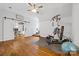 Spacious home gym and office featuring modern exercise equipment and an organized workspace for a healthy and productive lifestyle at 5523 Meadow Haven Ln, Charlotte, NC 28270