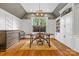 Elegant home office featuring custom built-ins, large windows, and stylish decor for a sophisticated and productive workspace at 5523 Meadow Haven Ln, Charlotte, NC 28270