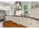 Well-appointed kitchen with updated appliances and stylish backsplash at 5523 Meadow Haven Ln, Charlotte, NC 28270