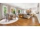 Open-concept living room and dining area with natural light and hardwood floors at 5523 Meadow Haven Ln, Charlotte, NC 28270