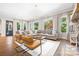 Bright living room with hardwood floors and views of the green outdoors at 5523 Meadow Haven Ln, Charlotte, NC 28270