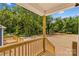 Spacious backyard with mature trees and wooden deck at 626 W Bell St, Statesville, NC 28677