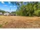 Large lot with single-Gathering homes in the distance at 626 W Bell St, Statesville, NC 28677