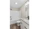 Bathroom with white tub and granite vanity at 626 W Bell St, Statesville, NC 28677