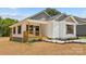 Charming home exterior with covered porch and landscaping at 626 W Bell St, Statesville, NC 28677
