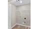 This laundry room has wood-look floors, wire shelving, and is ready for a washer and dryer at 626 W Bell St, Statesville, NC 28677