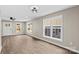 Bright living space featuring vinyl floors and large windows, providing natural light at 626 W Bell St, Statesville, NC 28677