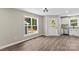 Living room featuring white trim, vinyl floors, natural lighting, stainless appliances, and a granite countertop at 626 W Bell St, Statesville, NC 28677