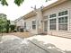 Cozy backyard with a stone patio, gravel area, and private yard at 6505 Central Pacific Ave, Charlotte, NC 28210