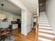 Welcoming entryway boasts hardwood floors, stairs to the upper level, and entry to the kitchen and living areas at 6505 Central Pacific Ave, Charlotte, NC 28210