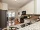 Open-concept kitchen and dining area featuring granite countertops and modern appliances at 6505 Central Pacific Ave, Charlotte, NC 28210