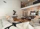 Spacious living room with soaring ceilings, hardwood floors, and stylish furnishings, overlooking a cozy dining area at 6505 Central Pacific Ave, Charlotte, NC 28210