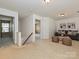 Spacious bonus room with neutral carpet, a cozy couch, and natural light from windows at 6505 Central Pacific Ave, Charlotte, NC 28210