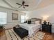 Comfortable main bedroom with tray ceiling, a ceiling fan, and ample natural light at 6505 Central Pacific Ave, Charlotte, NC 28210