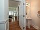 Well-lit powder room with pedestal sink, located off the entrance foyer at 6505 Central Pacific Ave, Charlotte, NC 28210