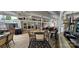 A spacious covered porch with a ceiling fan, dining set, grill, and outdoor seating at 6641 Monford Dr # 54, Conover, NC 28613