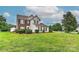 Charming two-story home with a well-manicured lawn and mature trees at 7007 Broad Leaf Ct, Indian Trail, NC 28079