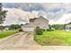 Home featuring an attached garage, a paved driveway, and manicured landscaping at 7007 Broad Leaf Ct, Indian Trail, NC 28079