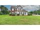 Charming two-story home with a well-manicured lawn and mature landscaping at 7007 Broad Leaf Ct, Indian Trail, NC 28079