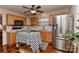 Bright kitchen featuring stainless steel appliances, wooden cabinets and an island at 7007 Broad Leaf Ct, Indian Trail, NC 28079
