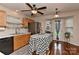 Bright kitchen featuring stainless steel appliances, wooden cabinets, hardwood floors and an island at 7007 Broad Leaf Ct, Indian Trail, NC 28079