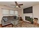 Comfortable living room featuring a fireplace, large television, and plush seating at 7007 Broad Leaf Ct, Indian Trail, NC 28079