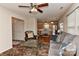 Comfortable living room featuring hardwood floors, plush seating, and an open layout to the kitchen at 7007 Broad Leaf Ct, Indian Trail, NC 28079
