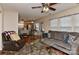 Bright living room with plush seating, hardwood floors, and an open layout to the kitchen at 7007 Broad Leaf Ct, Indian Trail, NC 28079