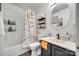 This is a standard bathroom with an updated vanity and shower/tub combination at 7442 Crestside Ln, Charlotte, NC 28227